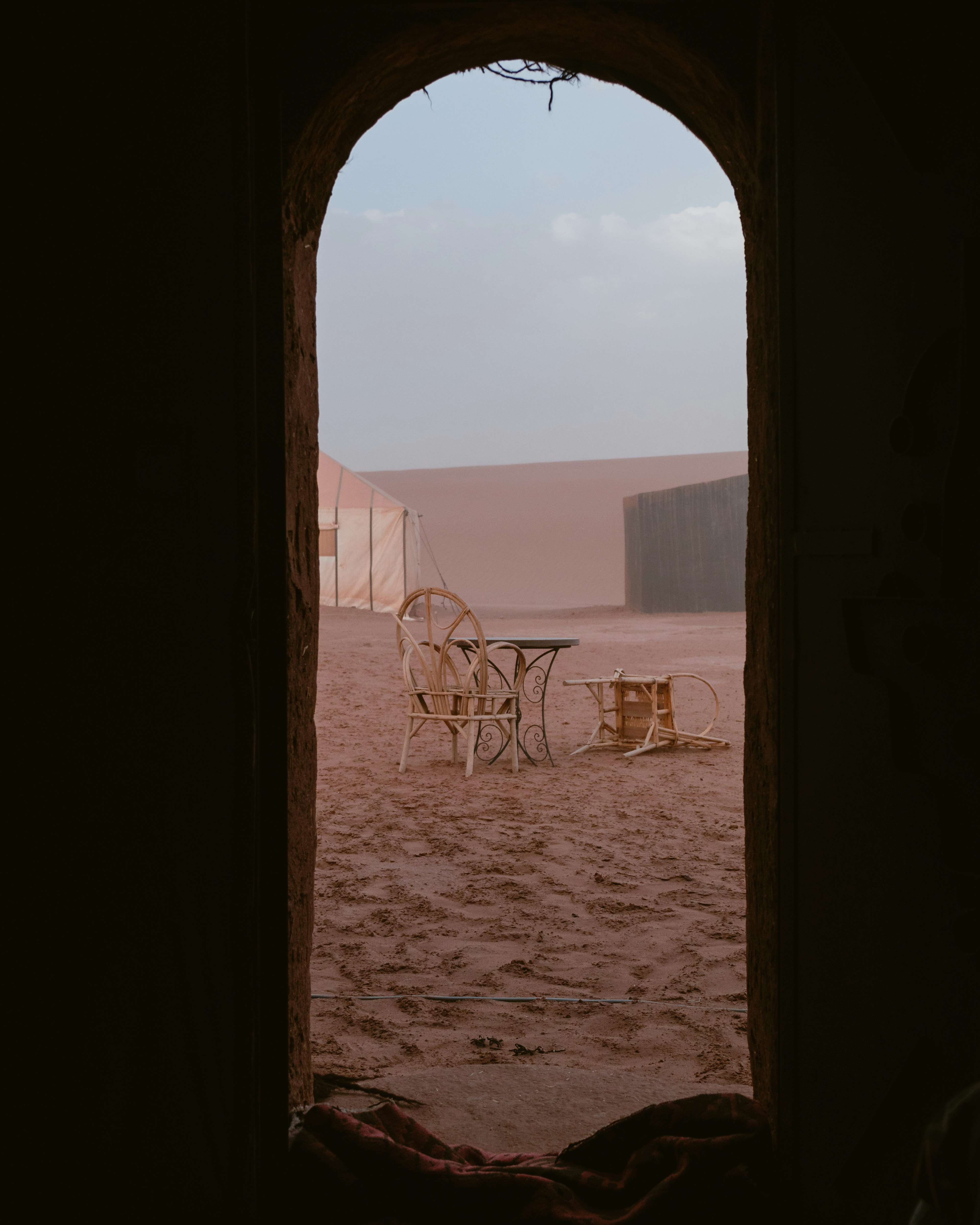 View on chairs in a desert through door