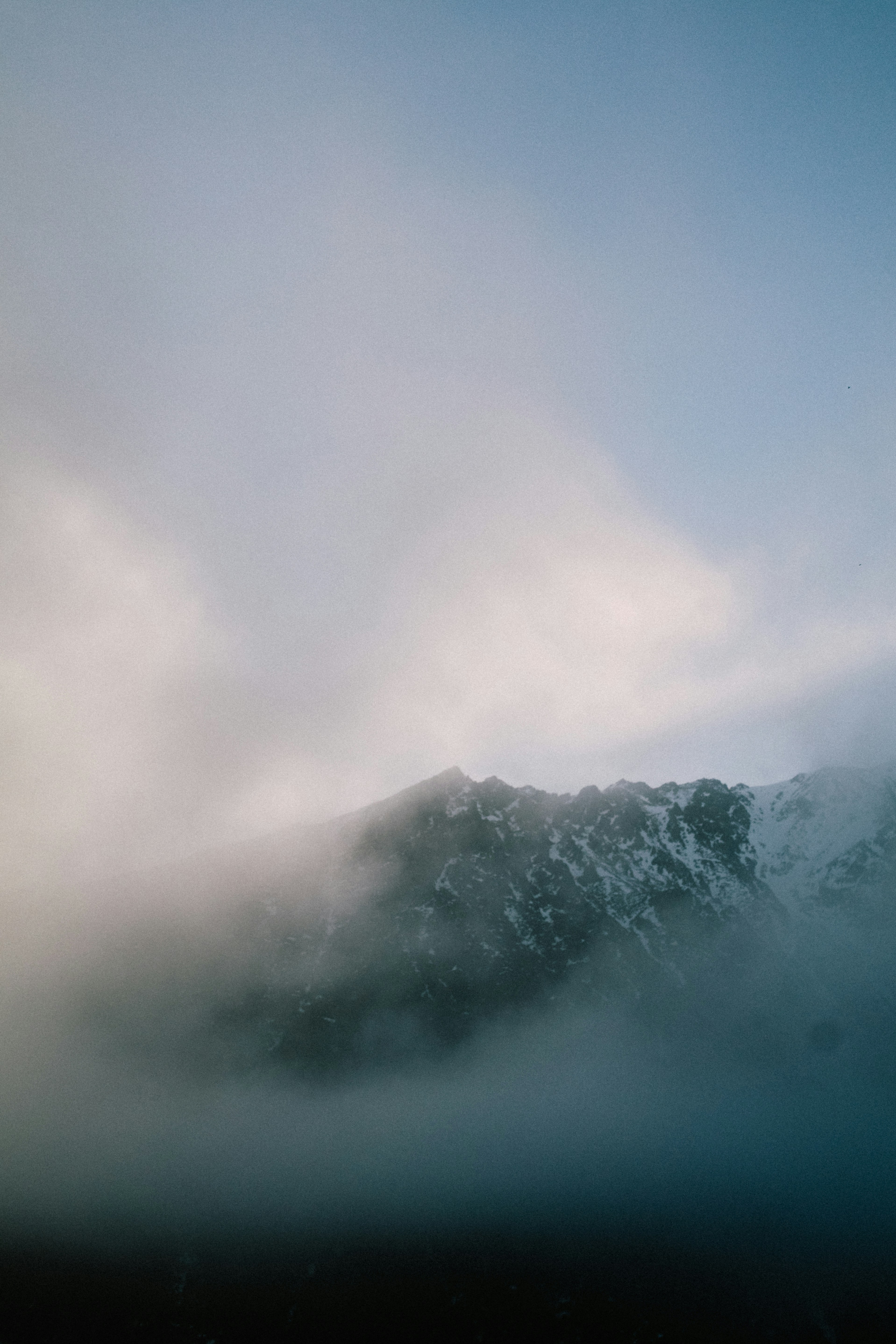 Mountain peak covered in clouds