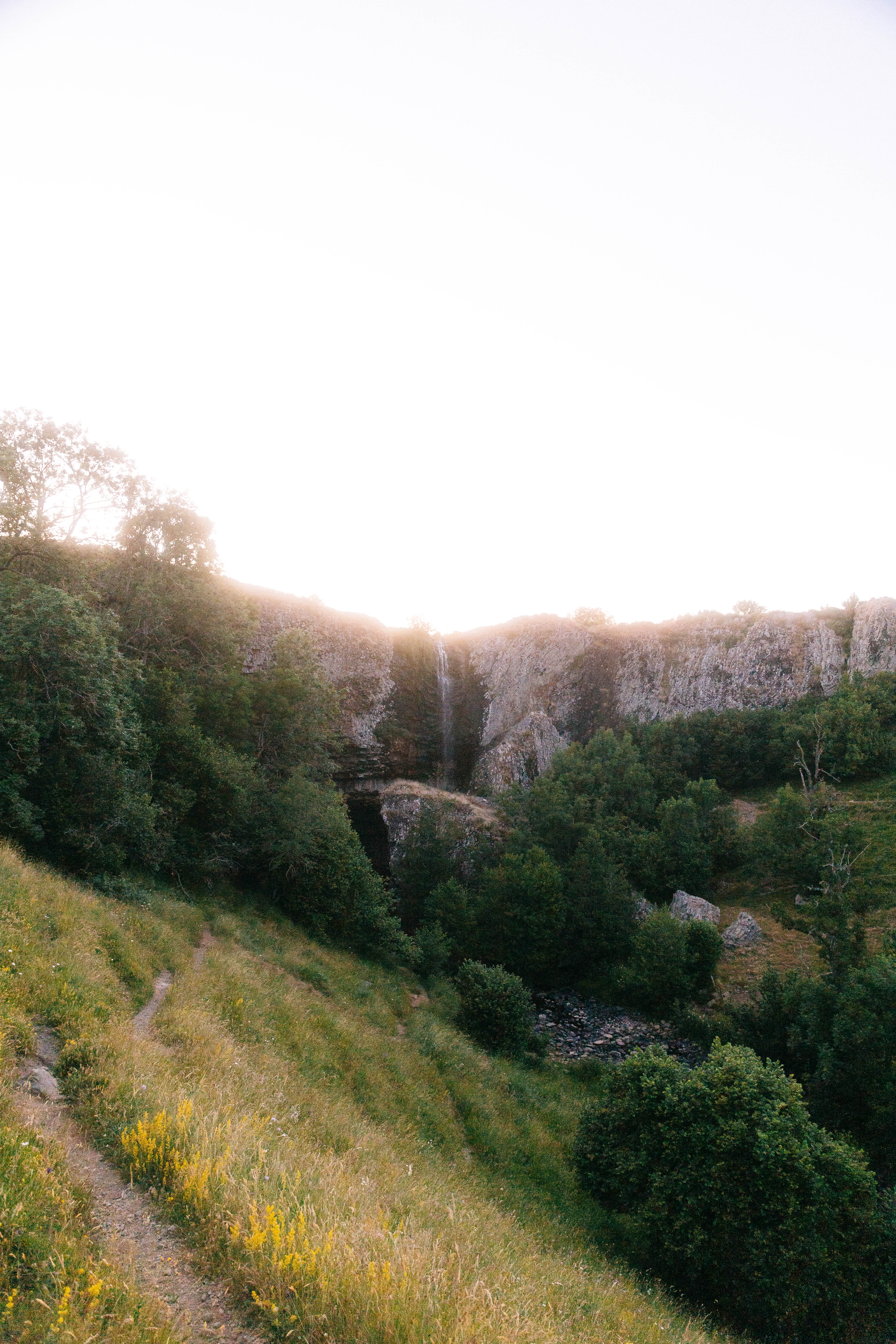 Path to a waterfall in a sunset