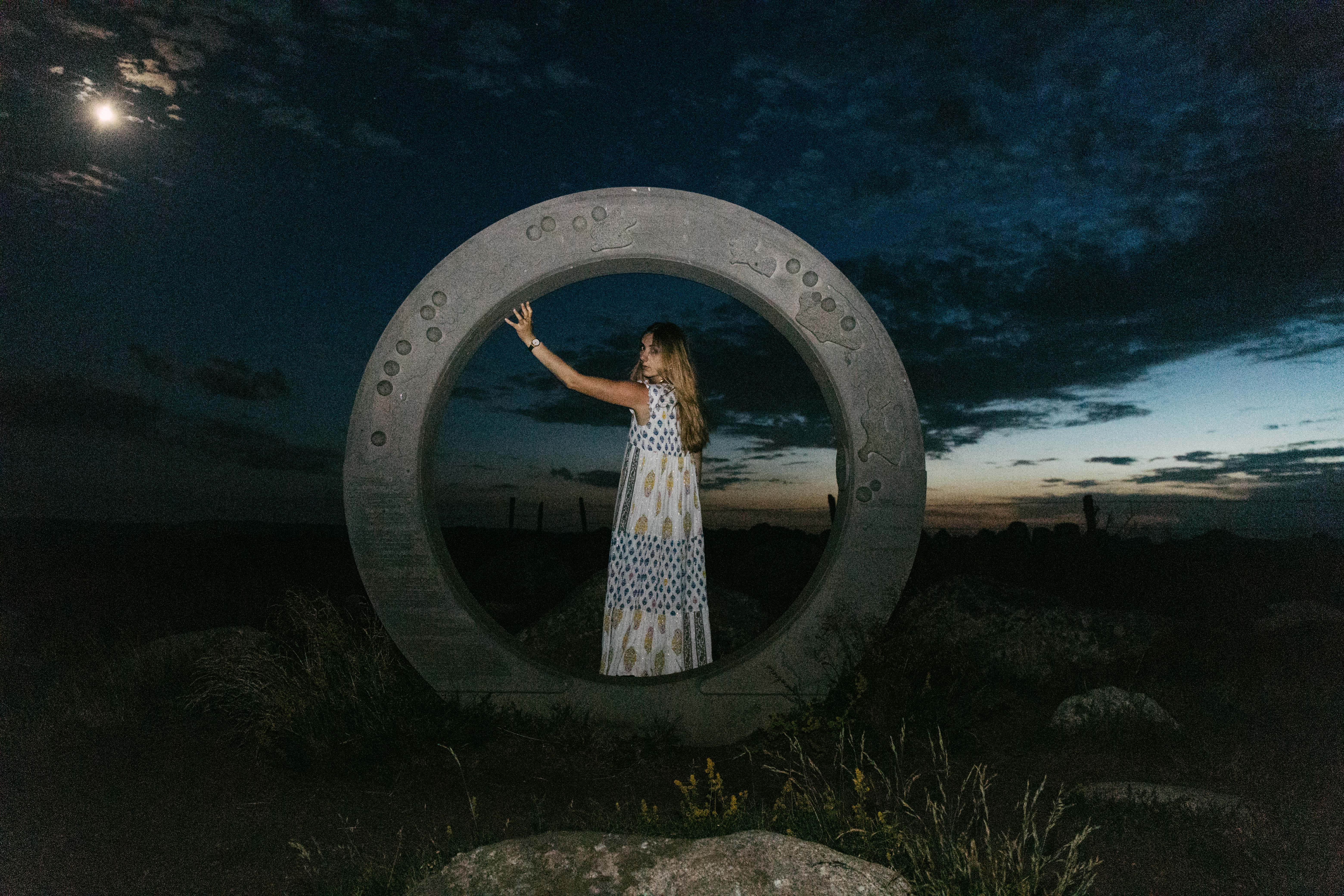 Woman in a circle structure turning back