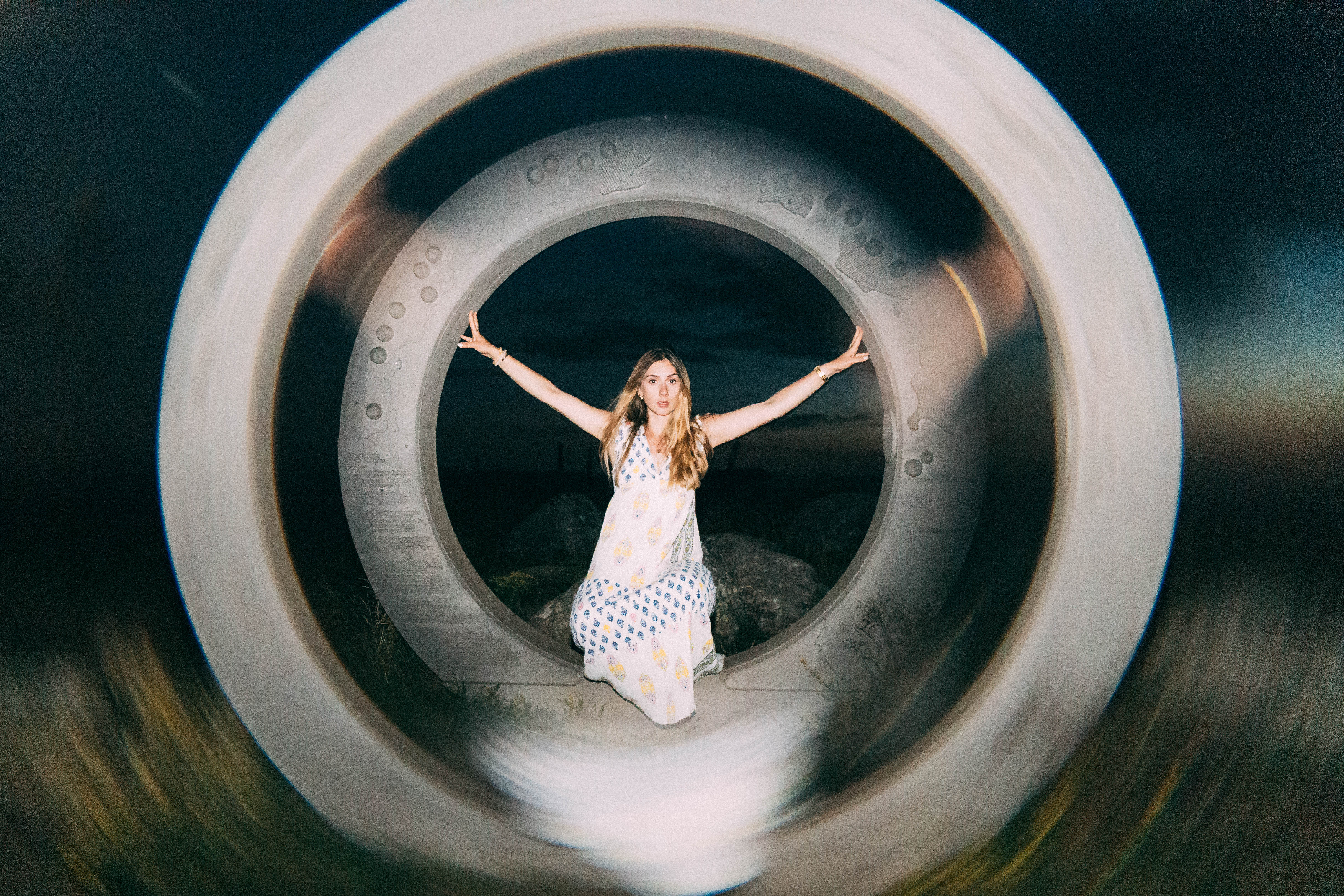 Woman standing in a circular structure